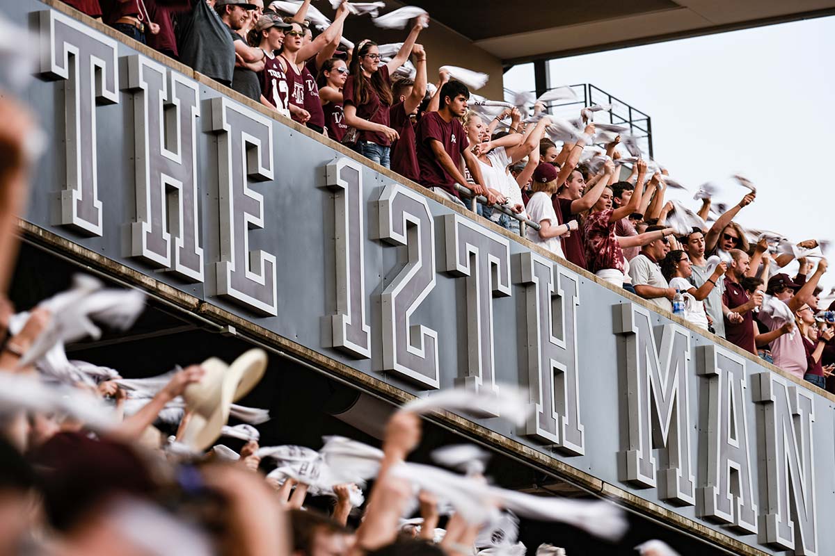 The 12th Man sign with fans above it