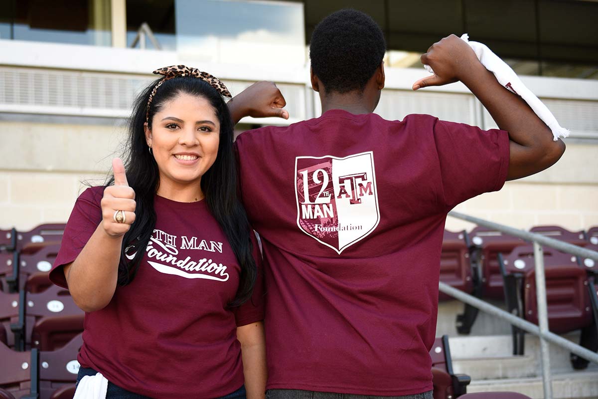 Students showing logo on their shirt