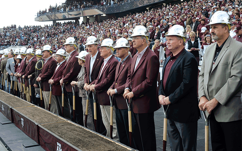 Looping images: 1. outside of stadium, 2. men with shovels getting ready to break ground