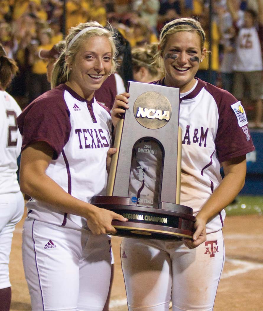 Amanda Scarborough and another softball player holding a NCAA trophy