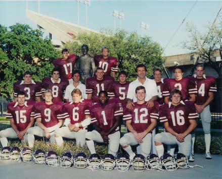 Old football team posing for a group photo