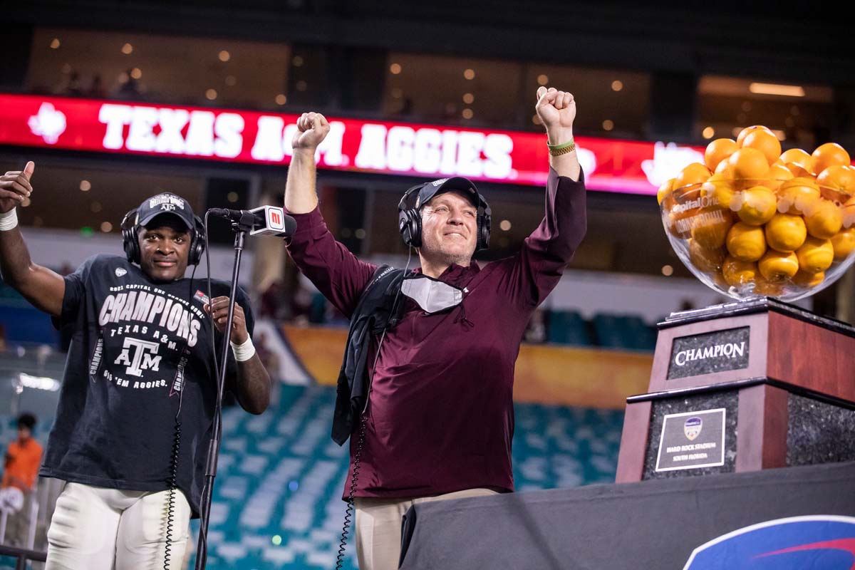 Jimbo Fisher with his hands in the air smiling