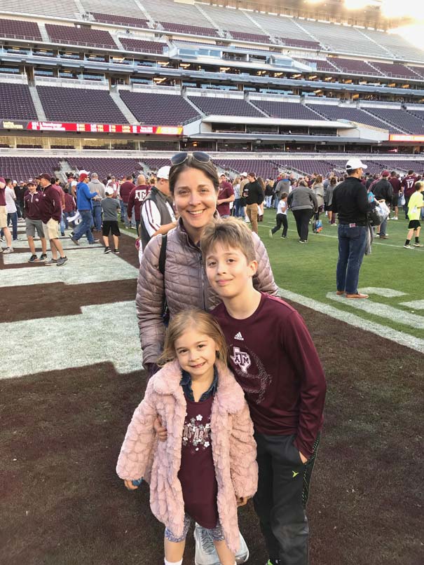 A family posing on the field