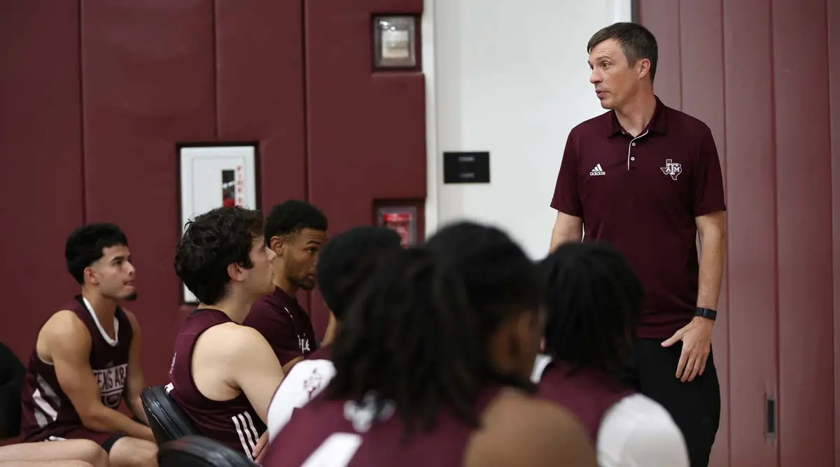 Bucky McMillan talking to team