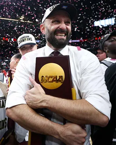 man holding trophy