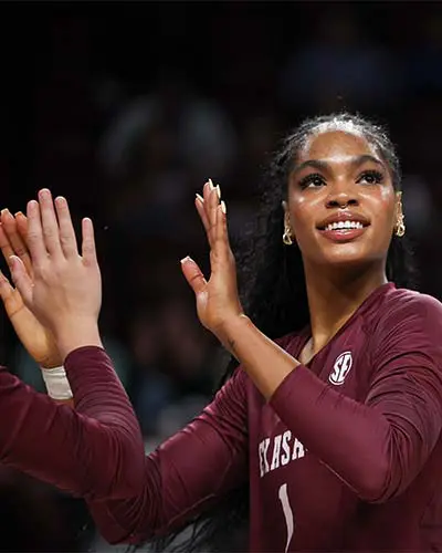 Woman high-fiving a teammate