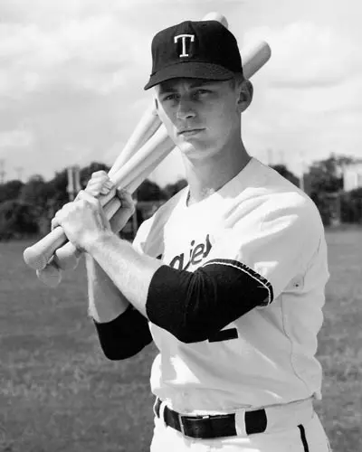 Mike McClure holding bats