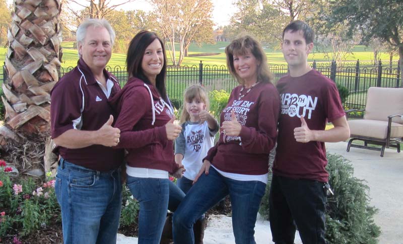 Rhonda & Frosty Gilliam Jr and their family giving thumbs up