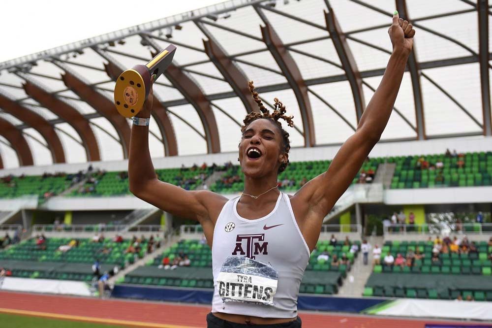 Tyra Gittens celebrating with trophy