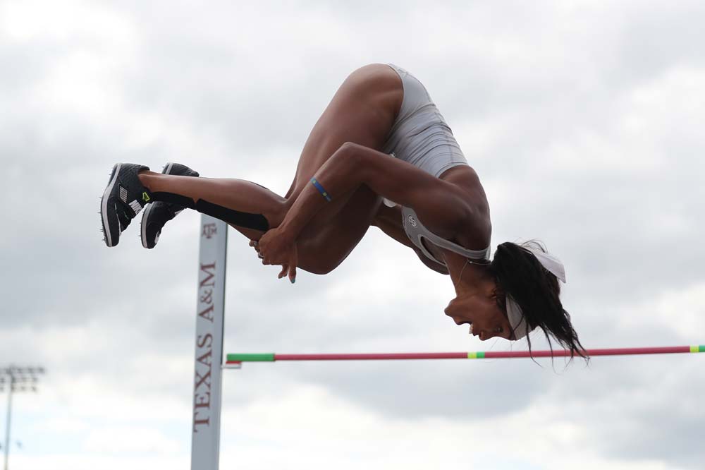 Tyra Gittens upside down mid-jump