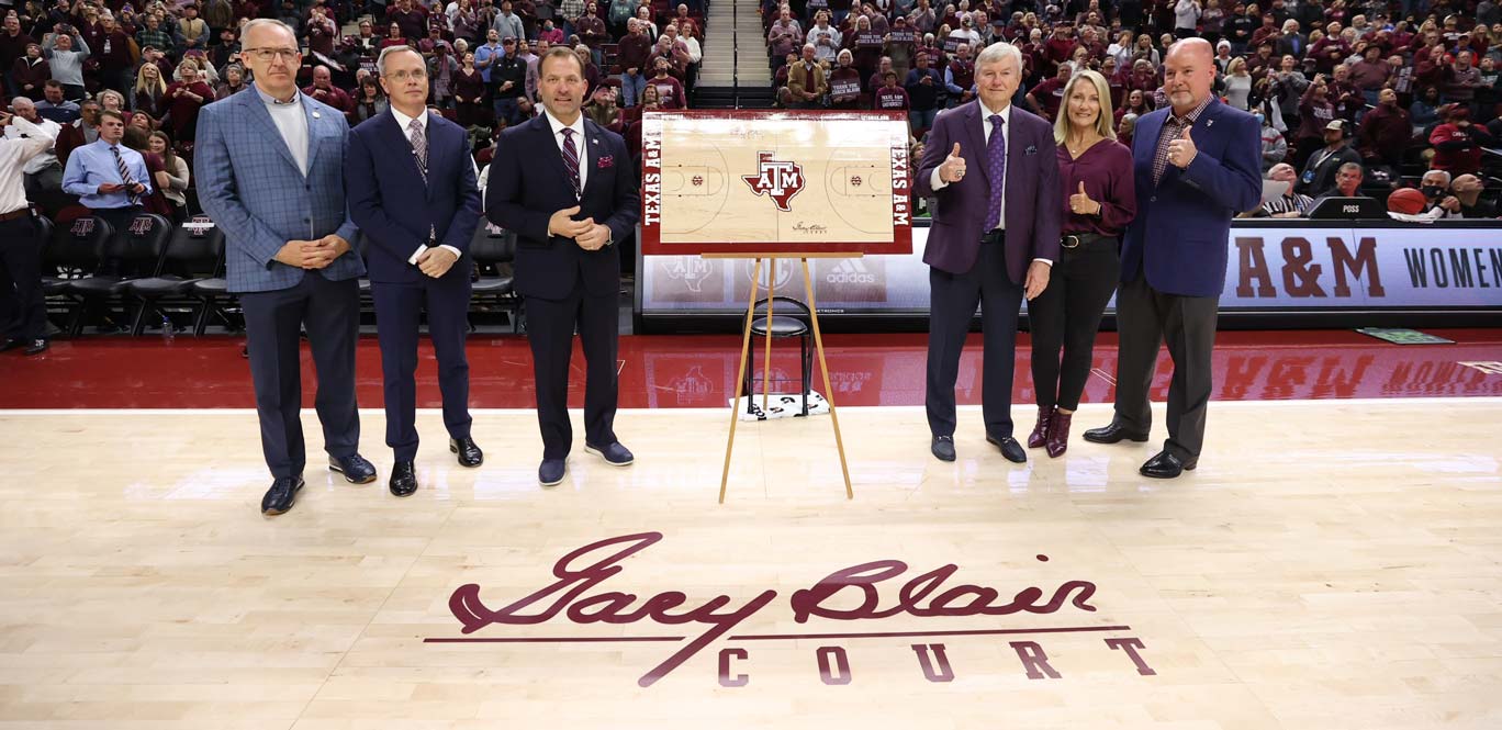 Gary Blair on the court with the women's basketball team