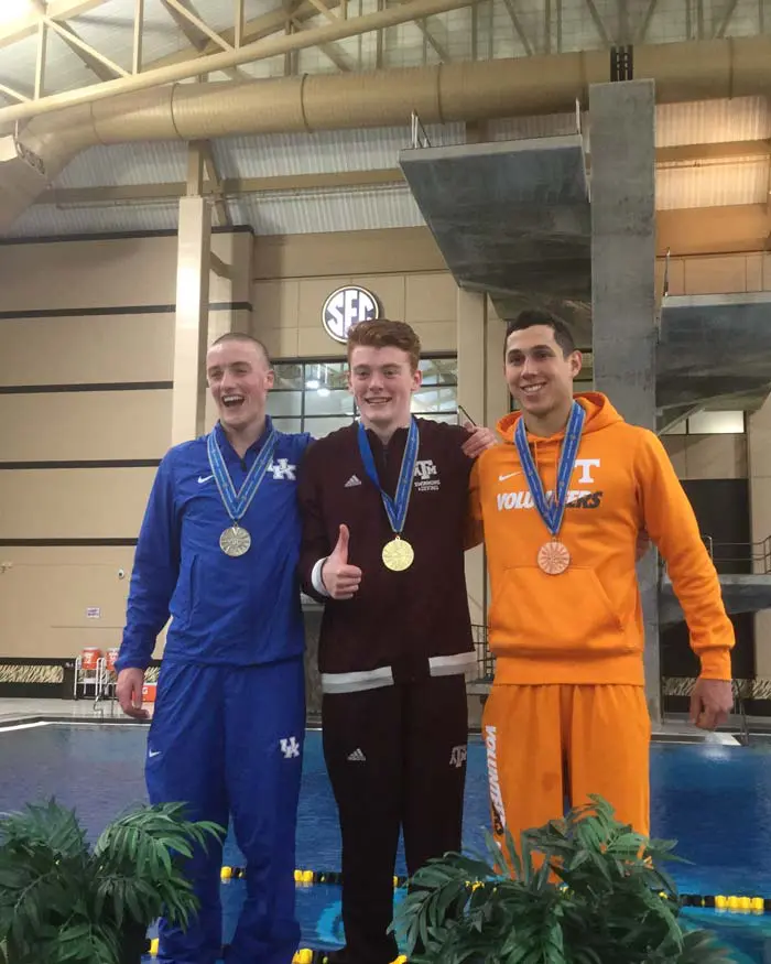 Sam Thornton posing with medal with other athletes