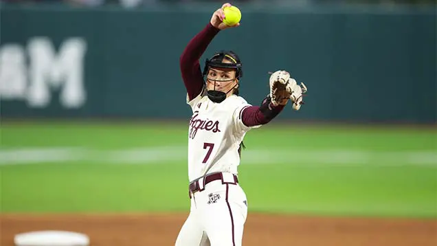 softball player throwing ball